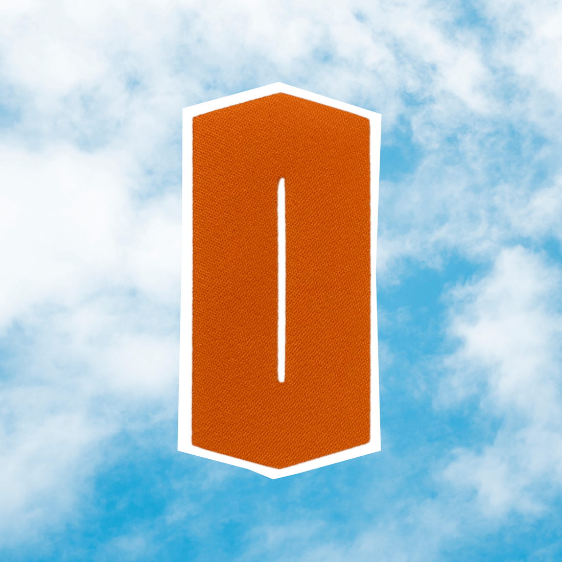 tube-eeze-port-patch-in-bright-orange-against-a-blue-sky-background,-designed-for-easy-g-tube-access.